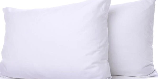 Twin pack of soft synthetic down pillows offering down-like comfort and medium support, ideal for guest rooms and everyday sleep from The Sleep Shop Ireland.